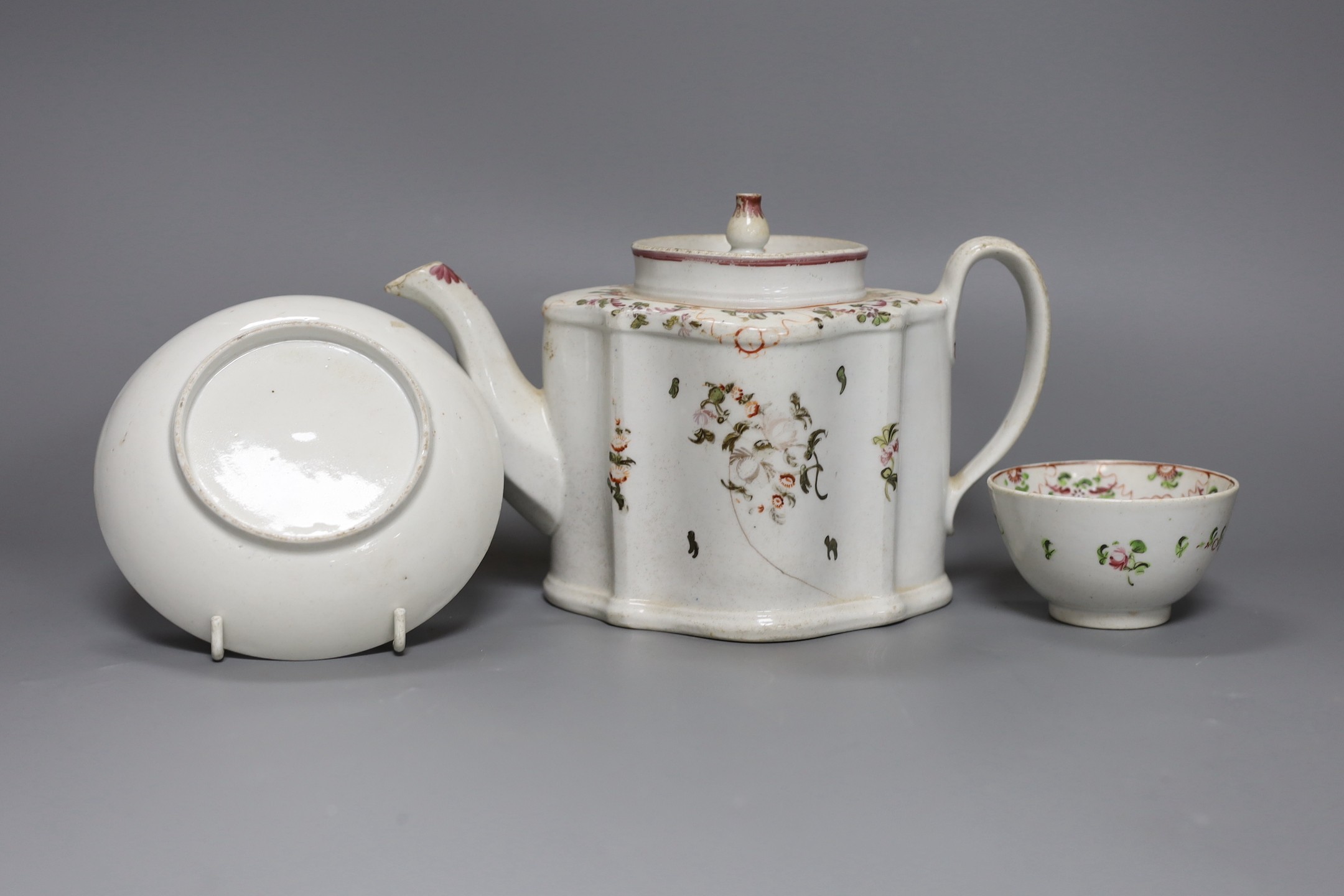 A New Hall type teapot and a similar tea bowl and saucer, teapot 15 cms high